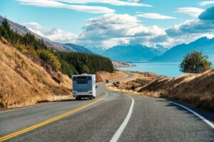 A motorhome drives down a South Island New Zealand road.